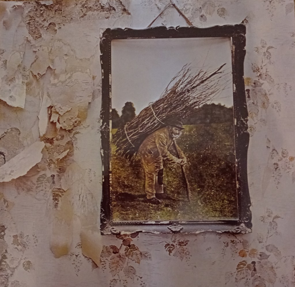 Led Zeppelin IV album cover - elderly victorian thatcher carrying bundle of sticks on his back